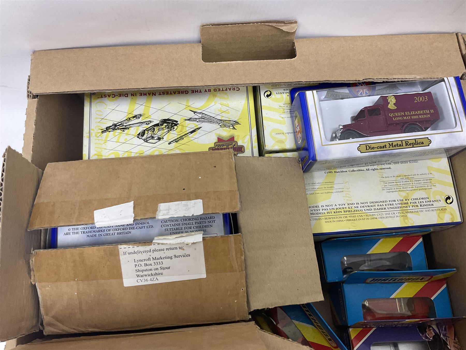 Quantity of boxed and loose die-cast cars to include a Dinky Fire Engine, Burago, Matchbox, Lledo etc in two boxes 