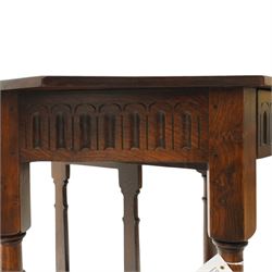 Gothic Revival oak fold-over console table, of octagonal form when unfolded, carved frieze with full length undertier 