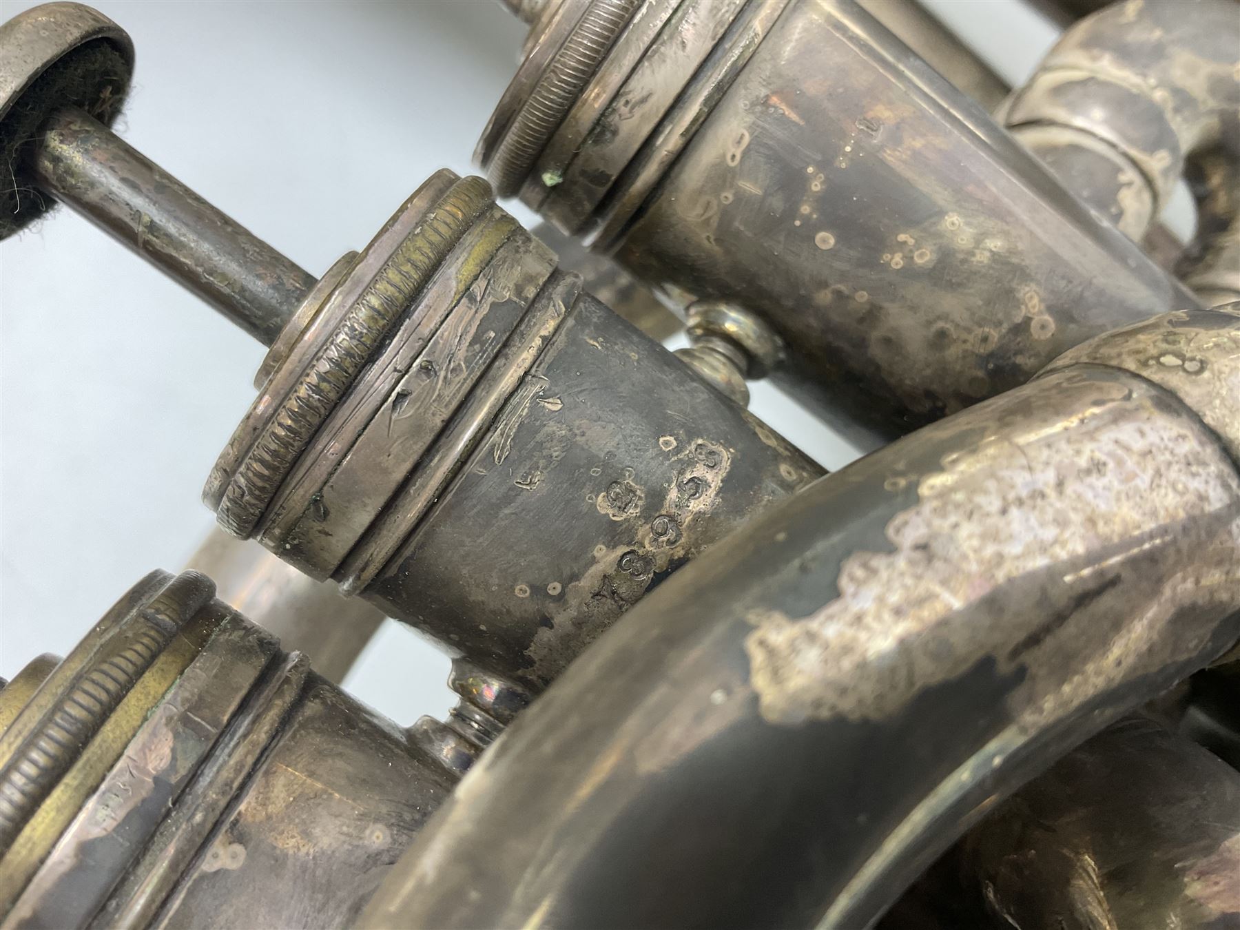 Boosey & Co silver plated 'Solbron' Class A Tuba c1920, serial number 102760, with compensating pistons and foliate engraved decoration H106cm 