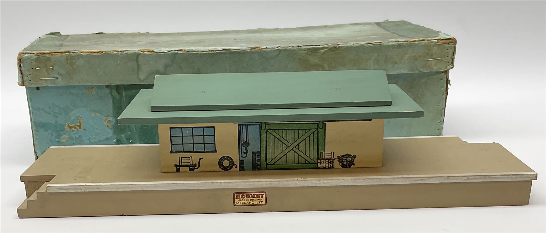 Hornby Dublo - wooden D1 Main Line Station and D1 Goods Depot, both in pale blue boxes; die-cast D1 Through Station in plain blue box; die-cast D1 Island Platform and D1 Signal Cabin, both in blue striped boxes (5)