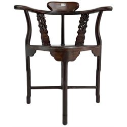 Chinese carved hardwood corner chair, outswept arms over pierced and carved floral splats, raised on shaped cylindrical supports united by X-stretcher