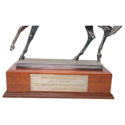 'The Freestone Stanley Lincoln Handicap Trophy, Doncaster Racecourse March 22nd 2003' - Silver filled model of a racehorse H32cm x W42cm on a mahogany plinth with silver plaque Sheffield 2003 Maker Laurence R Watson & Co.; together with a framed photograph of Guy Reed receiving the trophy (2)