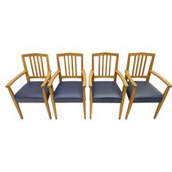 Modern twelve oak dining chairs including one 'Chairmans' chair, solid oak construction, slatted back and arm rests, blue leatherette padded seat, on tapered square supports 
