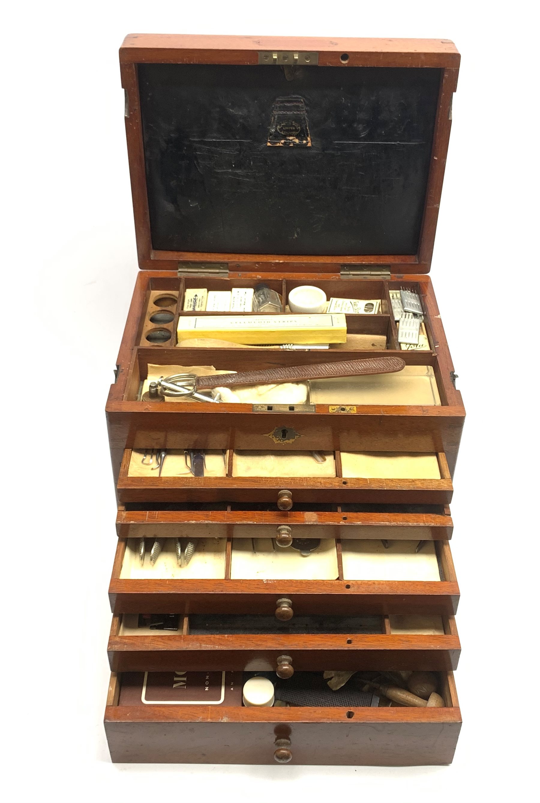  Dentistry - Late Victorian mahogany Dentists cabinet by C. Ash & Co, hinged cover above six long graduated drawers, enclosing a comprehensive arrangement of implements, pharmaceutical bottles, tools, modelling wax, porcelain teeth, 