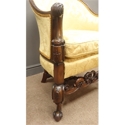  20th century walnut tub shaped armchair, shaped gadroon moulded back with acanthus carved scrolled arm terminals, matching supports, upholstered in gold Damask fabric with loose feather cushion, scroll carved middle rail, turned x-shaped stretchers, W68cm  