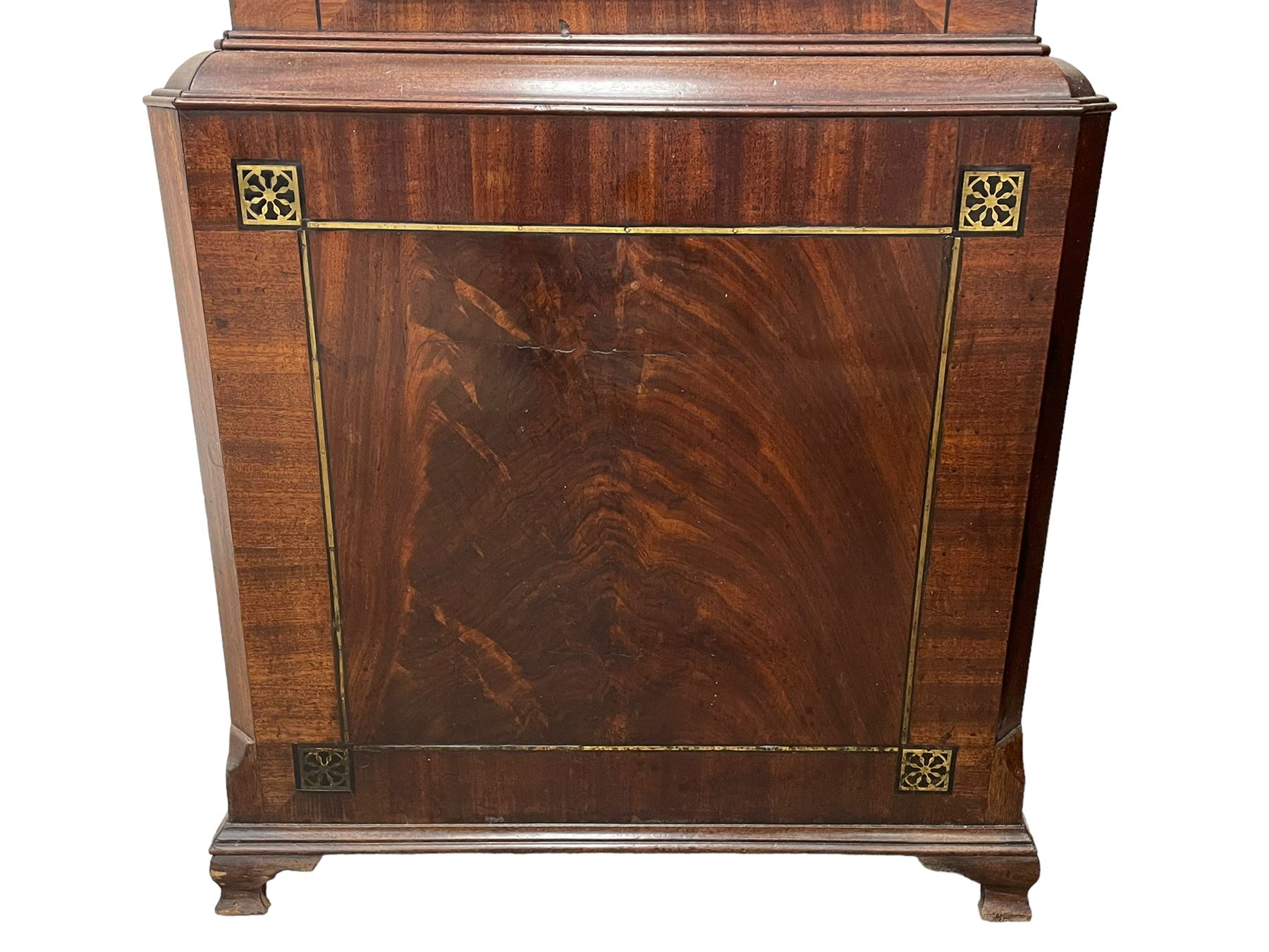 Nathaniel Dumville of Stockport - 8-day brass inlaid mahogany longcase clock c1840, swans neck pediment with ball and spire finials and wooden paterae, recessed break arch hood door flanked by rope twist pilasters, trunk with conforming pilasters and gothic ogee topped door, canted plinth raised on bracket feet, fully painted break arch dial with moon work and spandrels depicting the four seasons, centre with Roman numerals, minute track, subsidiary date and seconds dials, matching stamped brass hands, four pillar movement with an anchor escapement, rack striking on a bell. With weights and pendulum.
The Dumville family were prevalent Cheshire clockmakers working in Stockport 1820-42.
