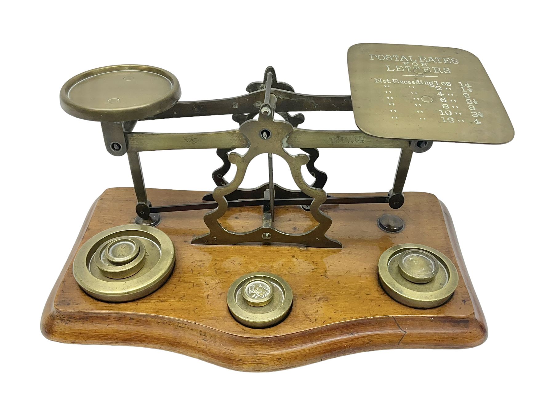 Set of brass postal scales, on wooden base
