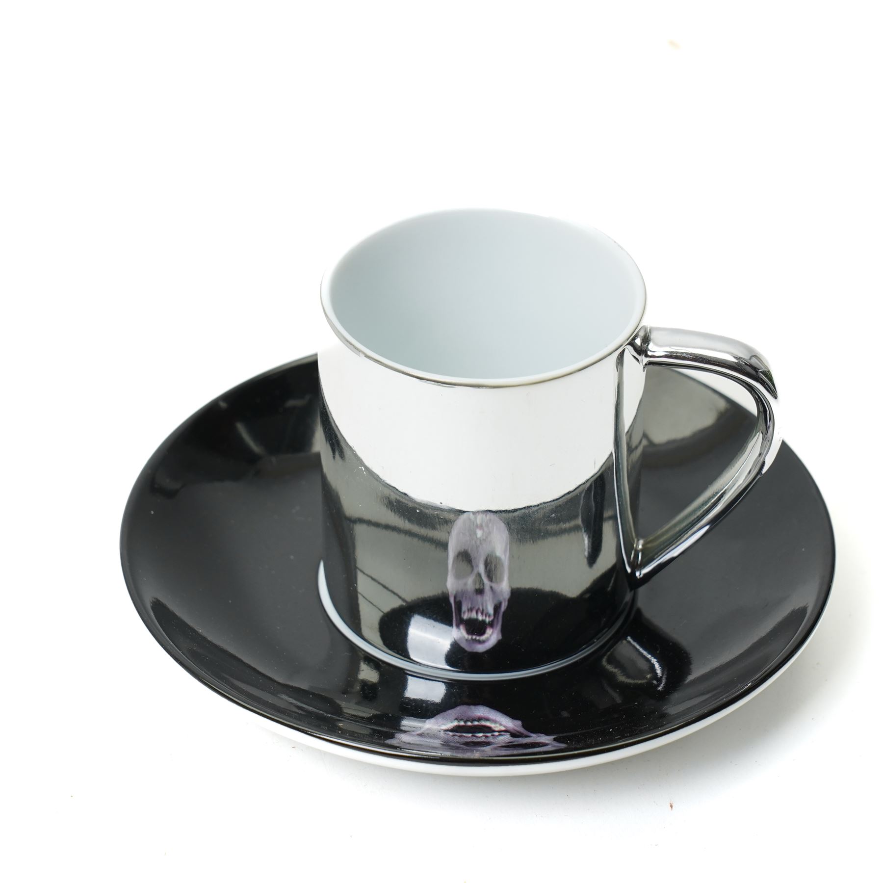 Damien Hirst (British 1965-); set of six anamorphic silver lustre espresso cups and saucers of various designs