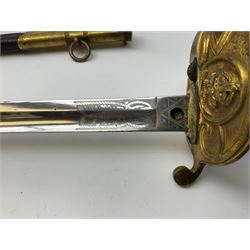 WW1 George V era 1827 Pattern Royal Naval Officer’s sword, the 80cm fullered steel blade decorated with crown, fouled anchor etc and marked Gieves Portsmouth London Edinburgh Devonport to the ricasso, gilded hilt with fouled anchor and crown, wire-bound ray skin grip, lion’s head pommel with mane backstrap, folding/locking langet and full bullion knot; in  leather scabbard having twin brass lockets with hand engraved panels and twin suspension rings L94cm overall. Provenance: By direct family descent from Brian Heathcote HMS Conqueror later Superintendant in the Liverpool Special Constabulary.