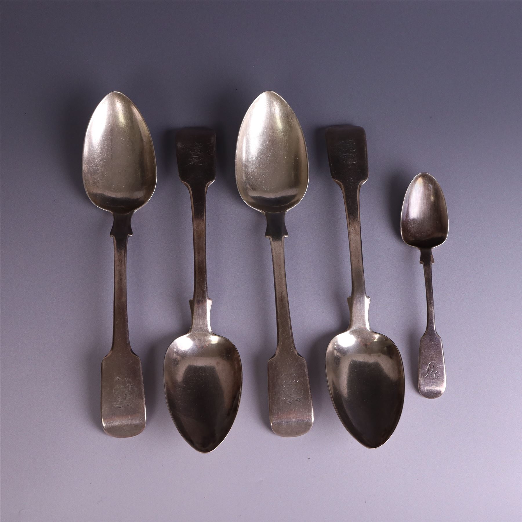 Set of four George III silver Fiddle pattern table spoons all engraved with monogram, hallmarked Thomas Wallis (II) & Jonathan Hayne, London 1819, together with a  Victorian silver Fiddle pattern teaspoon with engraved initials, hallmarked William Rawlings Sobey, Exeter 1846