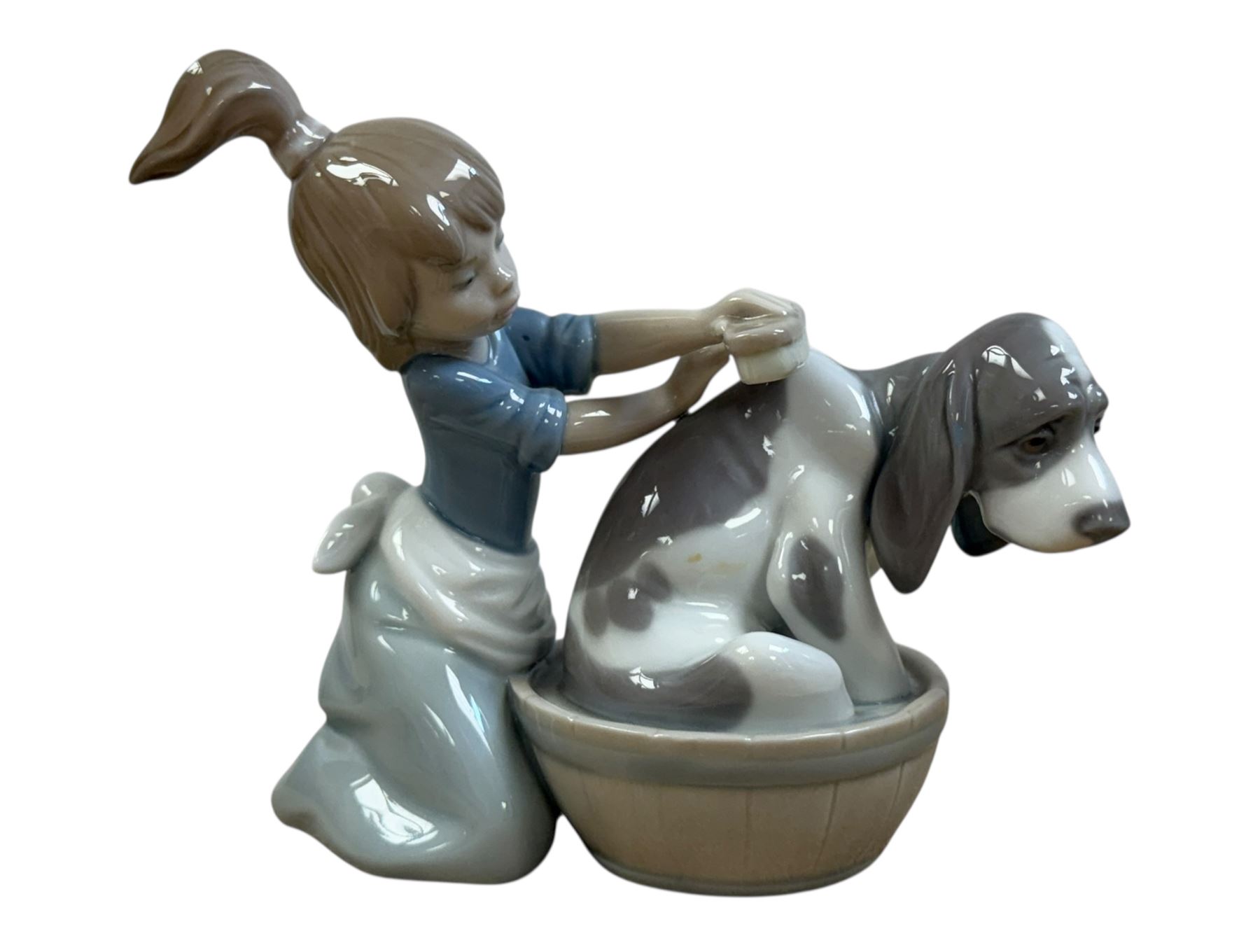 Three Lladro figures, Bashful Bather 5455, Pepita no 5372 and girl with lamb no 1010, together with two Neo figures and a Royal Doulton figure 