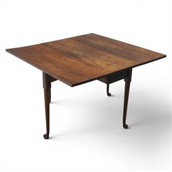 18th century solid walnut drop leaf table, with gate legs terminating in pad feet