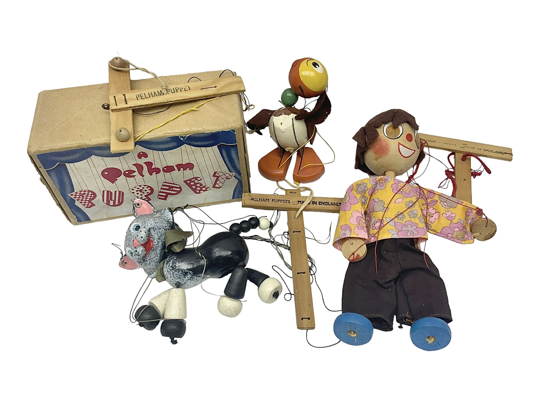Pelham Puppet - three puppets comprising a painted wooden duck with felt mouth and wings with metal joints H12cm, in original box and instructions; and two further examples Type A cat with a hollow body H12cm, and a boy H23cm (3) 
