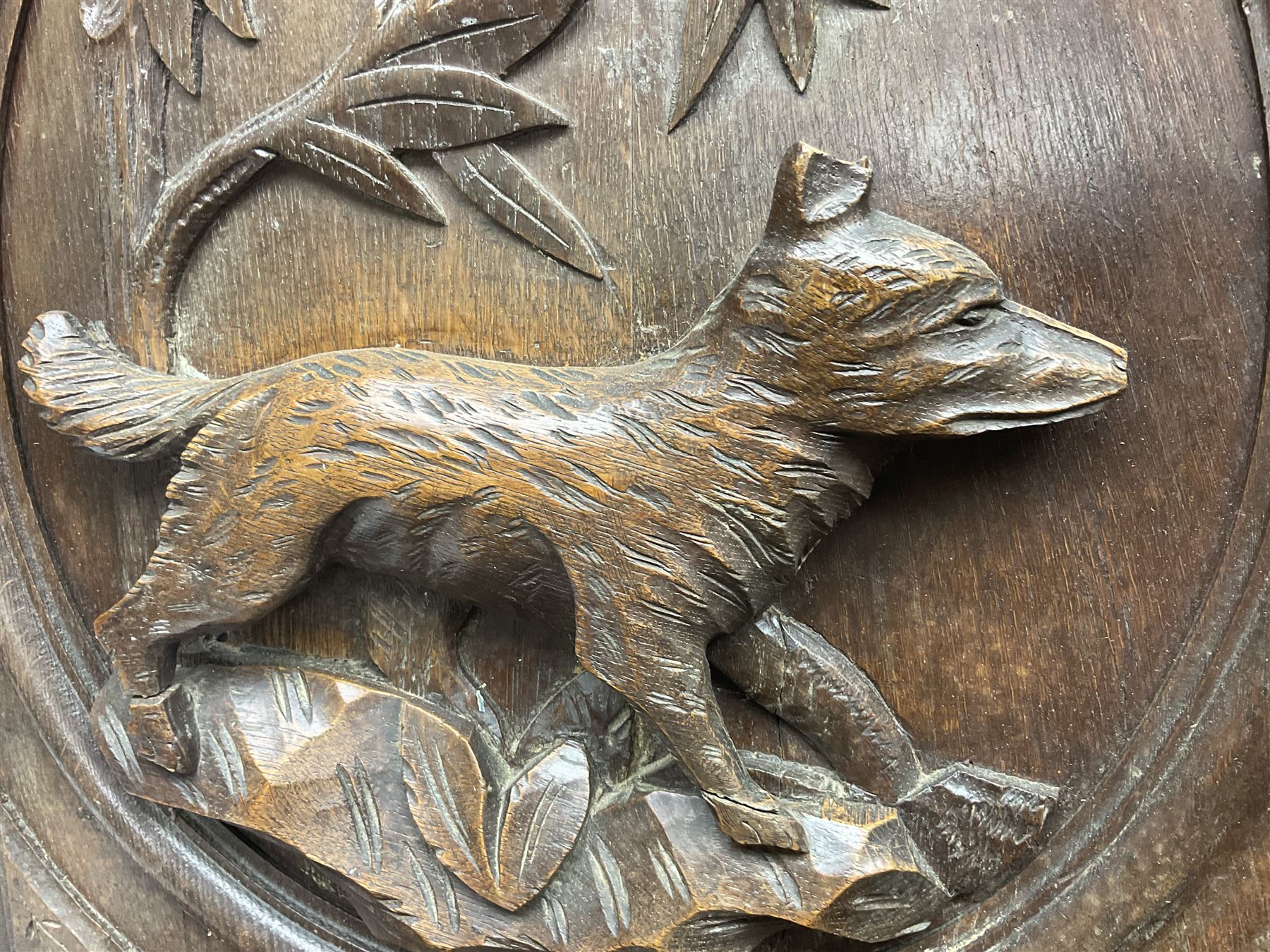 Pair of oak furniture door panels, carved in relief with a fox to one and a hound to the other, together with a pair of smaller oak panels, carved in relief with a hare to one and a grouse to the other, doors W63.cm x H62cm, panels W43cm x H60cm