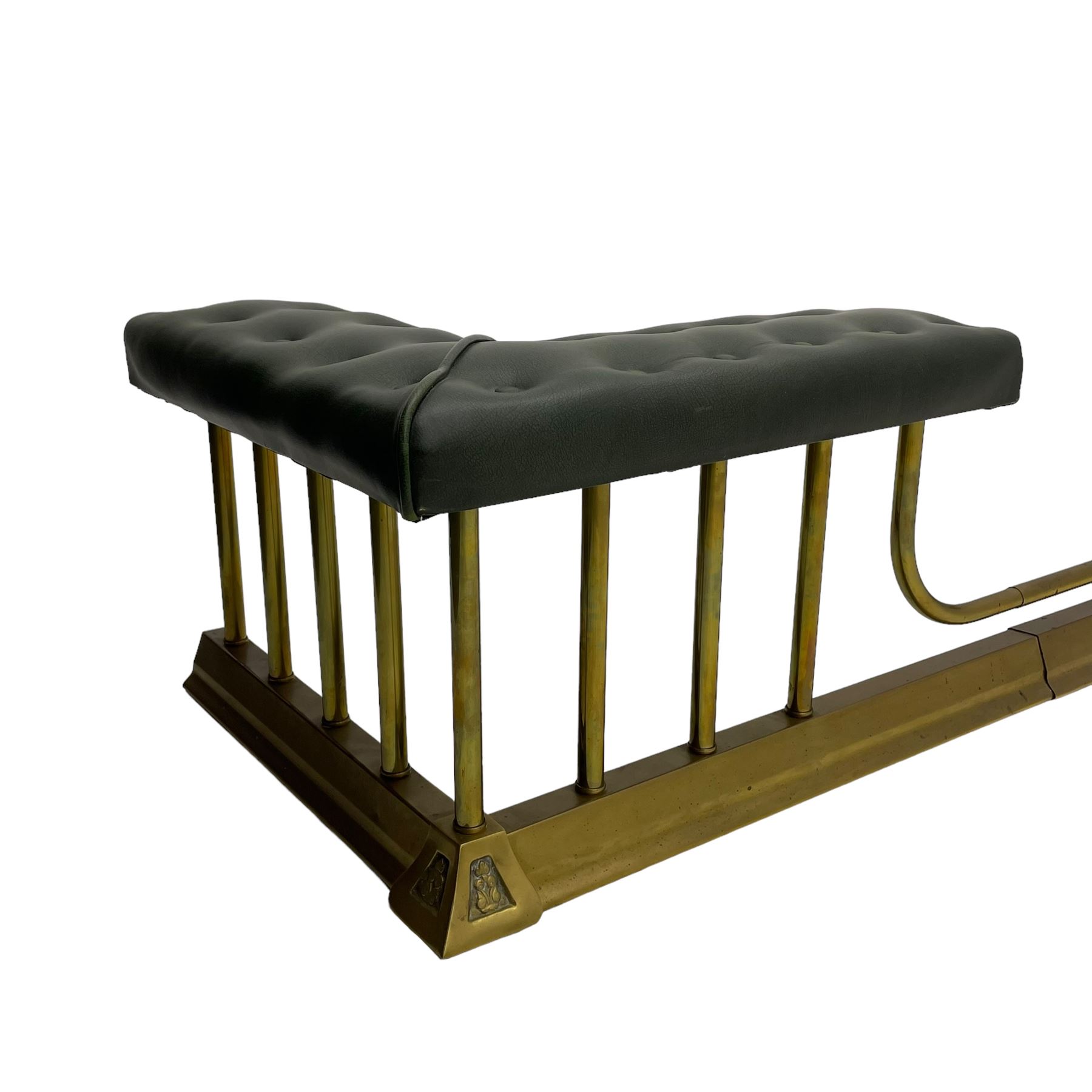 Victorian design brass telescopic extending club fire fender, the corner seats upholstered in buttoned green fabric over plain balustrade, on moulded base with floral cast corner brackets 