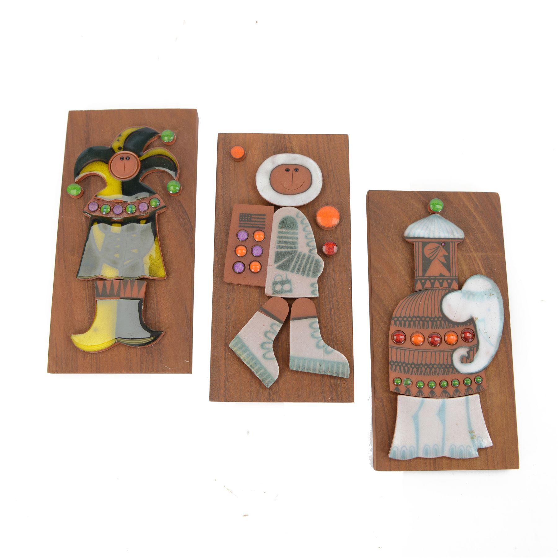 Three Hornsea Muramic handcrafted wall plaques, comprising Spaceman, Jester and Maharajah on Elephant, designed by John Clappison, H21cm, W10cm
