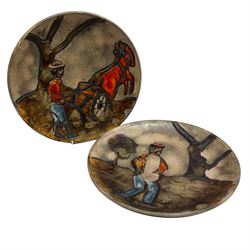 Pair of mid 20th century Ruscha West German pottery plates, the first example decorated with a man farming with horses, the second with a man in a field amongst trees, both with Ruscha Art stickers, D28cm