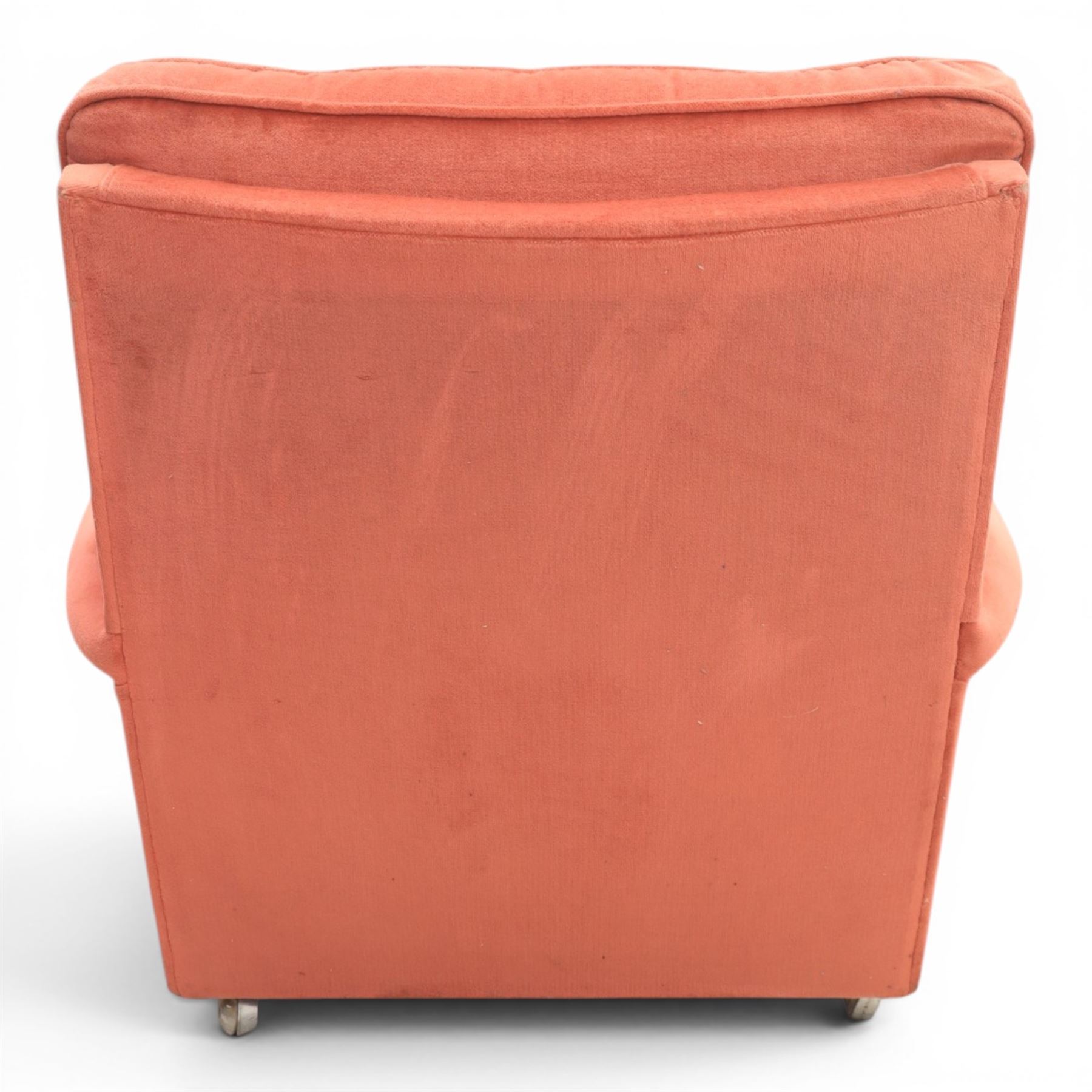 Parker Knoll - mid-century armchair suite, 'Model N30' recliner armchair with headrest and deep buttoned seat and back raised on castors, a wide armchair with deep button back and seat raised on castors, a wingback chair with flared scrolled arms, raised on cabriole supports