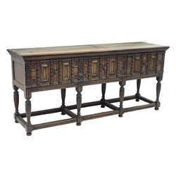  17th century style oak sideboard, three large drawers, heavily carved front, on tapering supports connected by stretchers, W203cm, H91cm, D56cm  