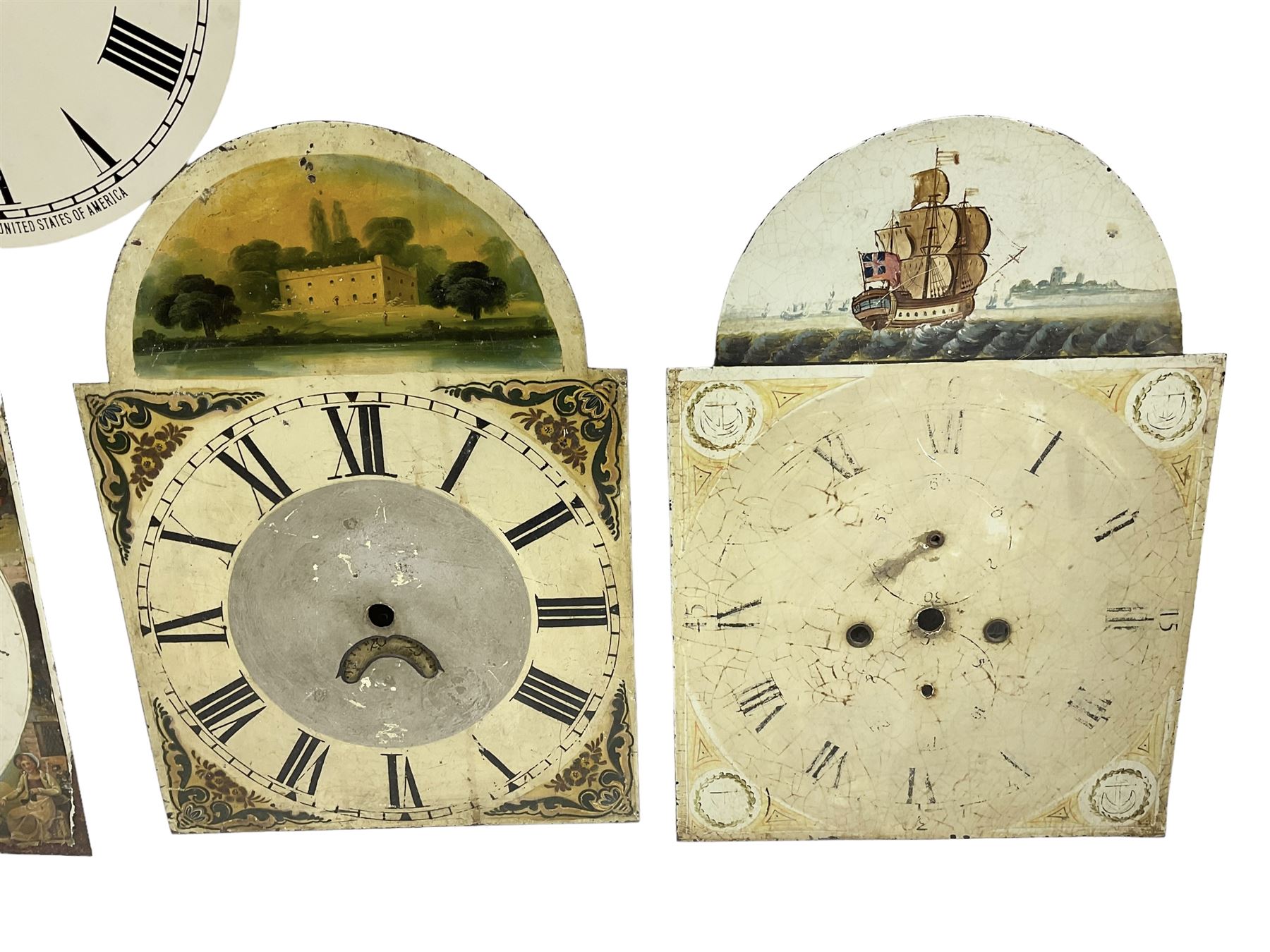 Four 13” painted 19th-century break arch longcase clock dials with one circular 12” American wall clock dial, plus two 11” and one 10” 18th-century brass longcase dials.