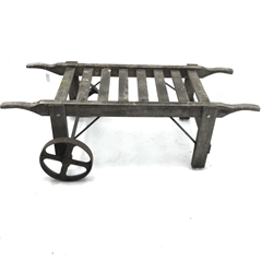 Early 20th century timber framed pig cart with two cast iron wheels, W87cm, H53cm, L161cm