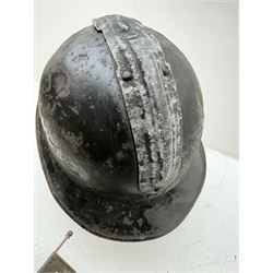 French M26 Genie (engineers) steel helmet with attached comb and helmet plate, together with WWI trench lamp