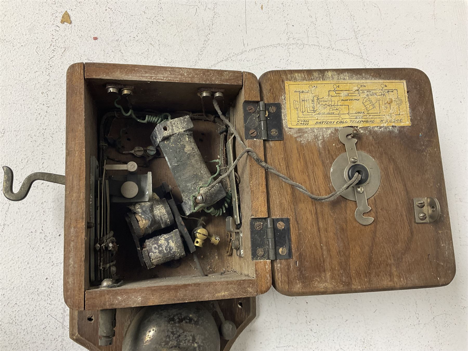 Two Hunningscone patent wall mounting telephones in walnut casing, together with Sterling Telephone & Electric Co. Ltd early wall-mounted telephone 'Primax' and one other 