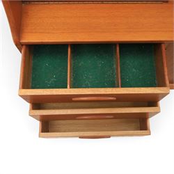 Jentique - mid-20th century teak highboard, fall front cabinet next to a sliding door cupboard above and open recess, the lower section with cabinet doors and three graduated drawers, raised on cylindrical legs