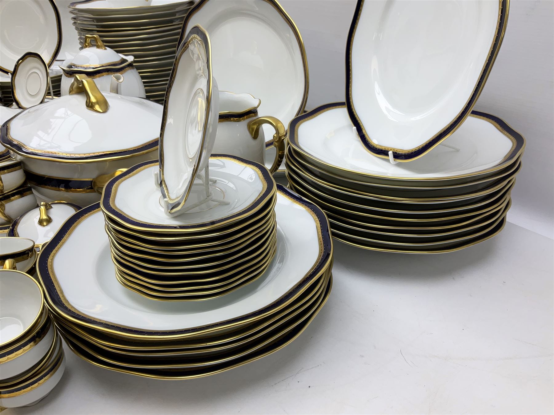 Pirkenhammer of Czechoslovakia Carlsbad pattern tea and dinner for twelve place settings to include dinner plates, soup bowls, side plates, covered tureen, tea cups and saucers, coffee cups and saucers, teapot, milk jug, covered surier, etc, with an addition twelve dinner plates (110)