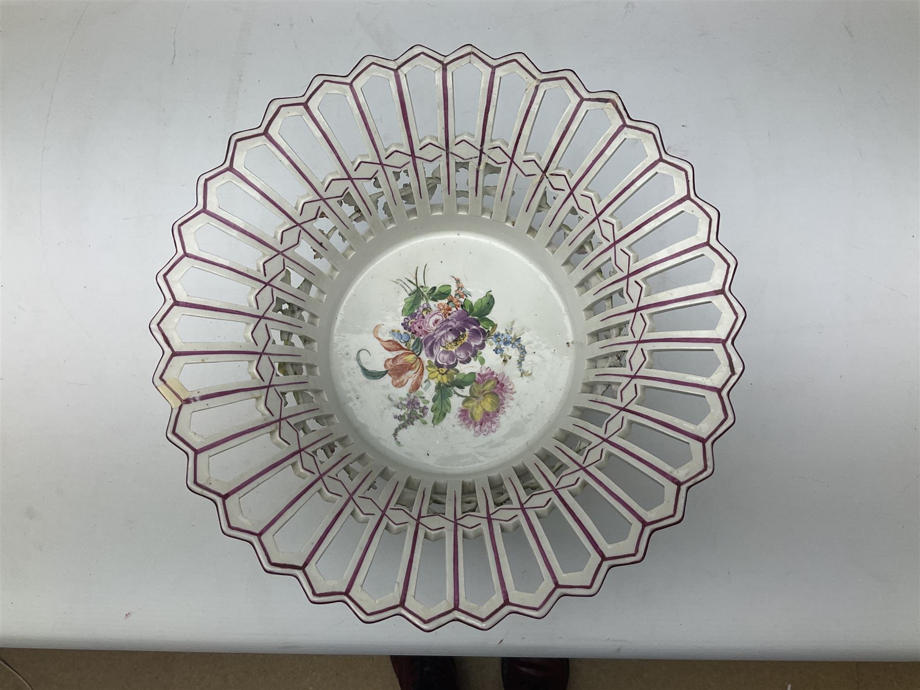 Early 20th century Dresden floral encrusted pierced bowl, centrally painted with flowers, on four tapering supports, D30cm 