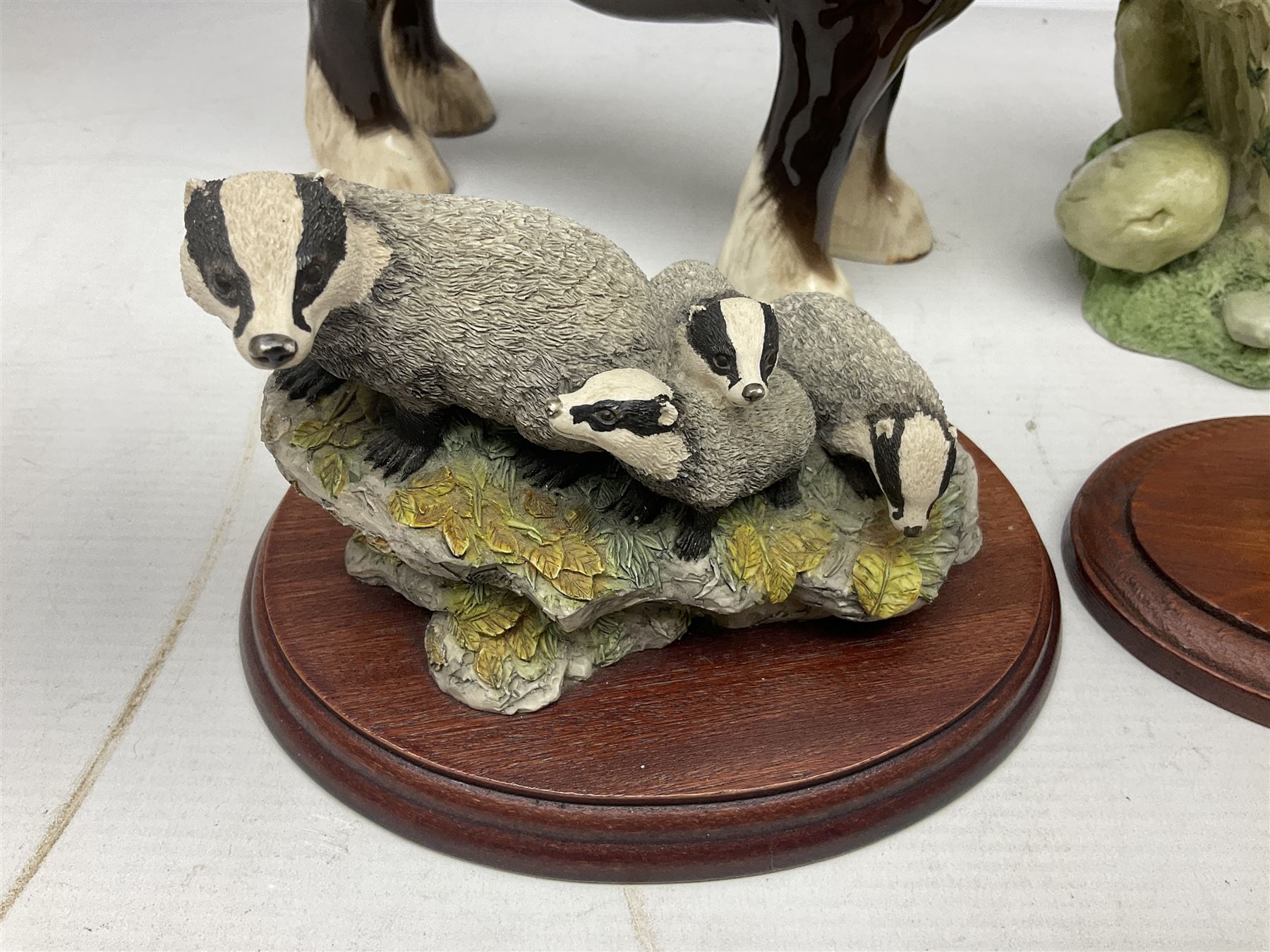 Two Border Fine Arts figures, comprising Badgers and Blackbird, together with Beswick bay shire horse no 818 and another figure