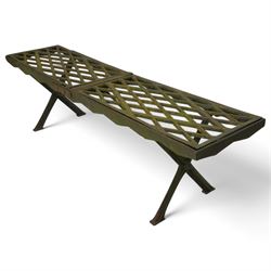 Two cast iron garden benches, rectangular seat with lozenge grate panels, on X-framed supports 