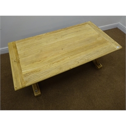  Light wood planked top coffee table, shaped supports joined by single stretcher on sledge feet, W130cm, H50cm, D70cm  