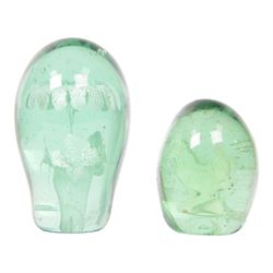 Two 19th century green glass dump paperweights, each of globular form, the smaller example with internal sulphide cockerel, H9cm, the larger with internal sulphide floral bloom, H13cm