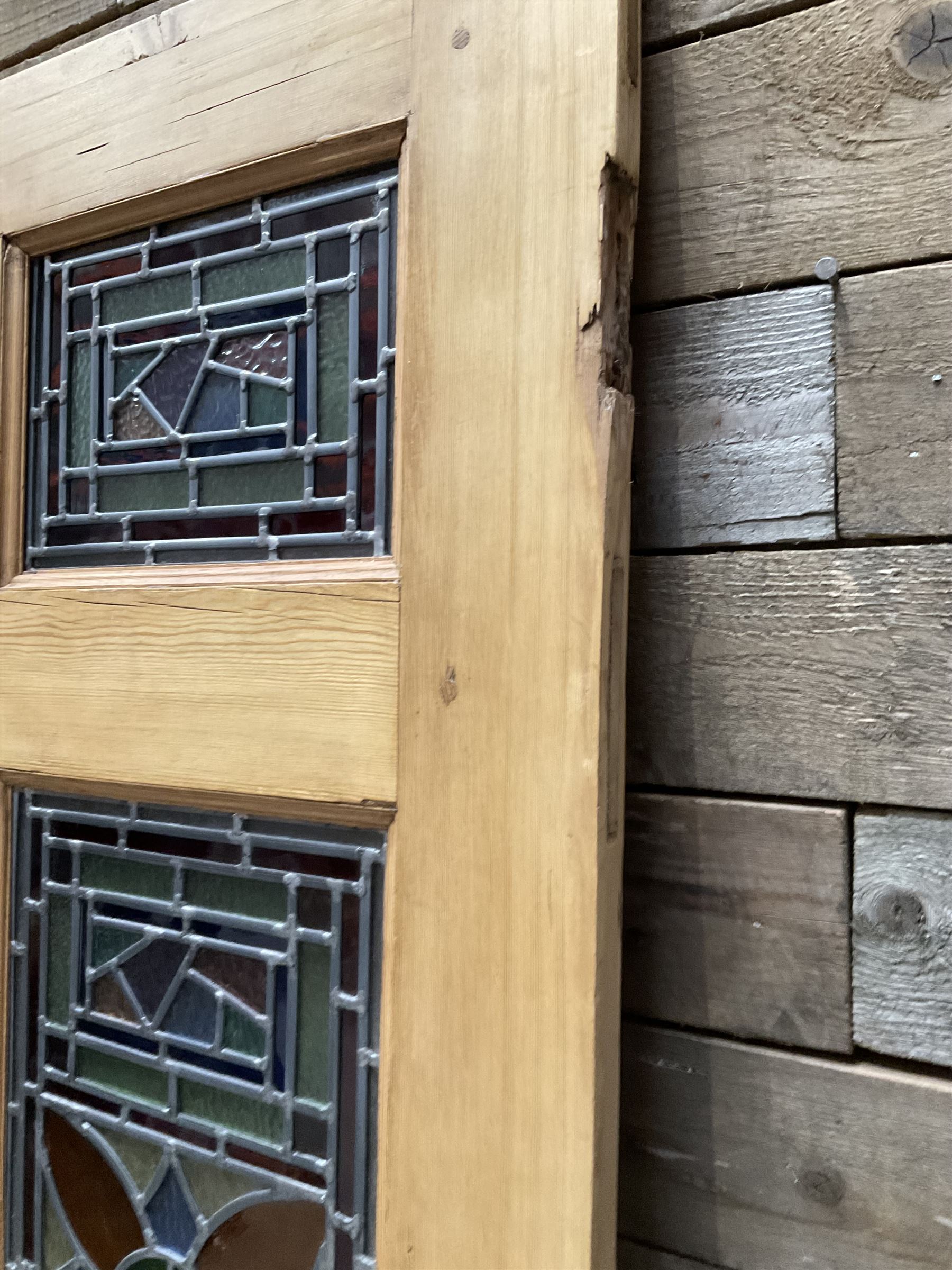 Early 20th century pine six panel door with later stained glass panels