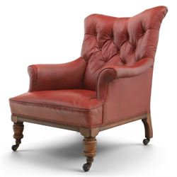Early 20th century style oxblood red leather Chesterfield armchair, deep buttoned shaped b...
