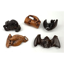 Group of five Japanese Meiji carved wooden netsukes, comprising two bats, frog on bamboo, two frogs, and rat on fruit, largest L7cm, (5)   