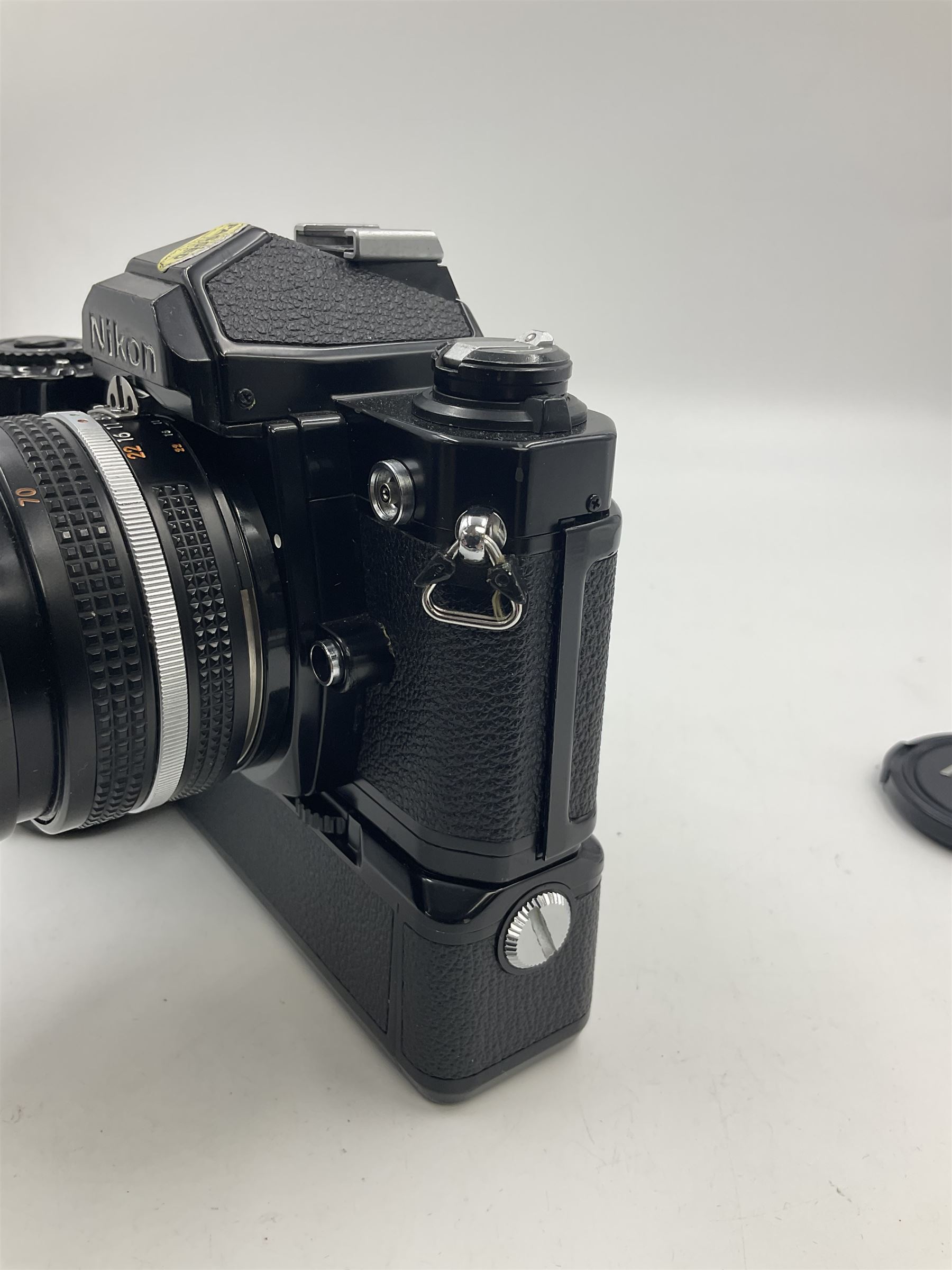 Nikon FM2n camera body, serial no. N8683100, with 'Nikon Zoom-NIKKOR 35-70mm 1:3.3-4.5' len, serial no. 2236565, Nikon MF-16 data back, serial no. 212905 and Nikon MD-12 Motor Drive, serial no 1570382 