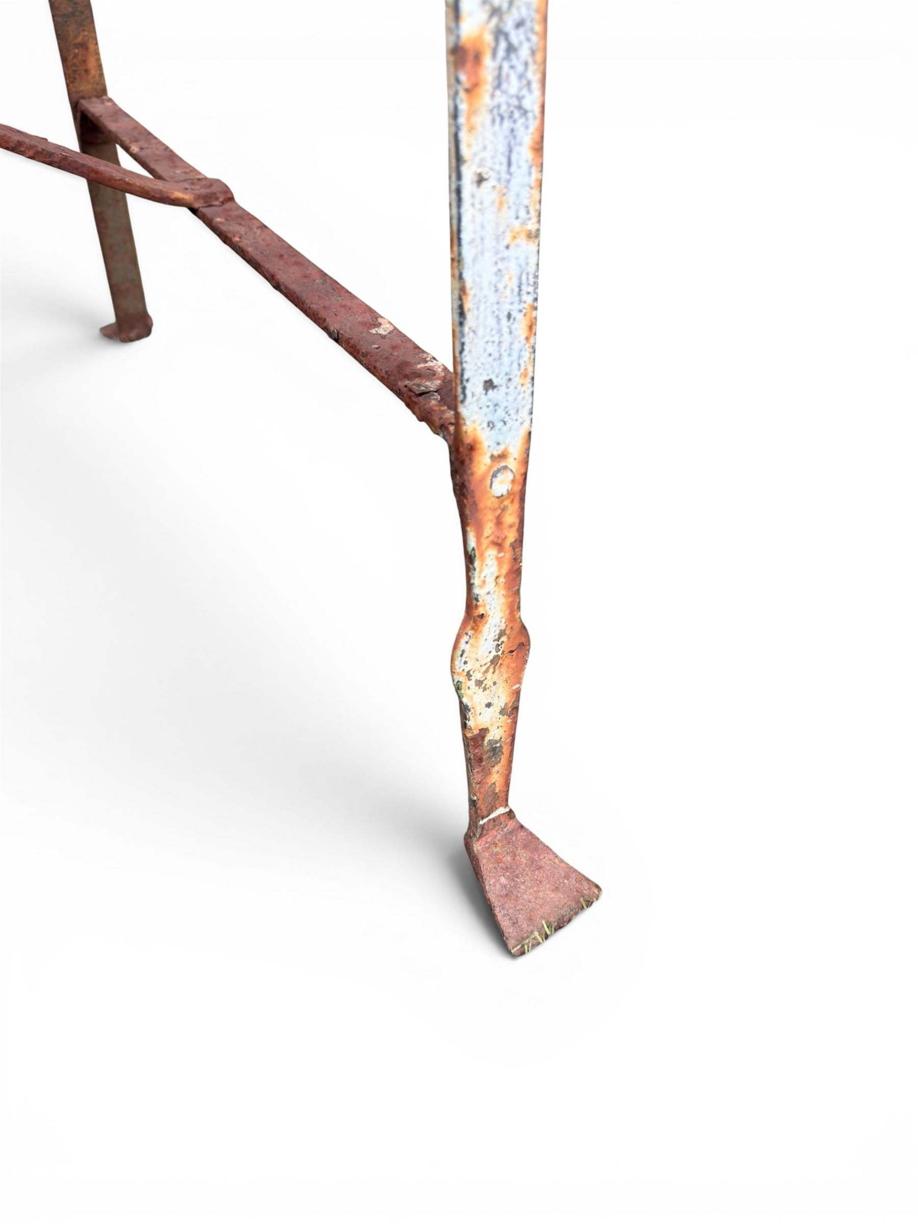 Regency period wrought iron strapwork garden bench, cresting rail with central Scottish thistle motif and flanking pediments, in distressed blue painted finish