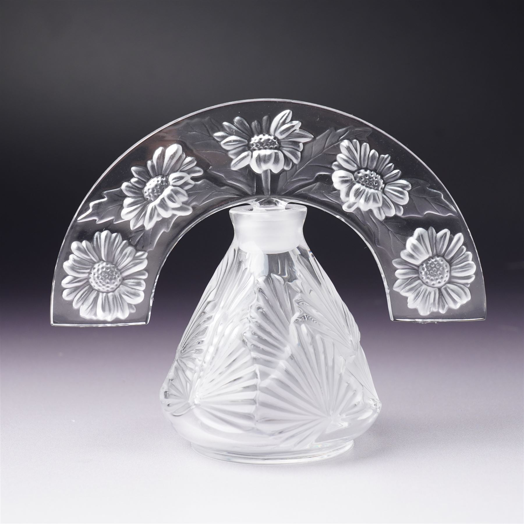 Lalique clear glass ' Clairefontaine' scent bottle with frosted glass stopper H12cm and another Lalique 'Folie' scent bottle  with arc tiara stopper H10cm both inscribed 'Lalique, France' (2)