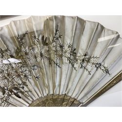 Oriental silk fan, with embroidered floral and decoration with etched gilded sticks and guards, housed in a glazed wood case, H45.5cm W71cm