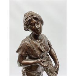 After Mestais, a bronzed spelter figure, modelled as a female figure holding a basket of fish, with signature, upon circular ebonised base, overall H57cm, together with a bronze modelled as a nude female figure, signed to base Noel, overall H25cm. 