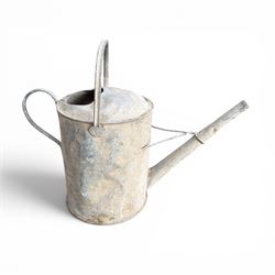 19th century milk churn with weathered patina along with aluminium watering can