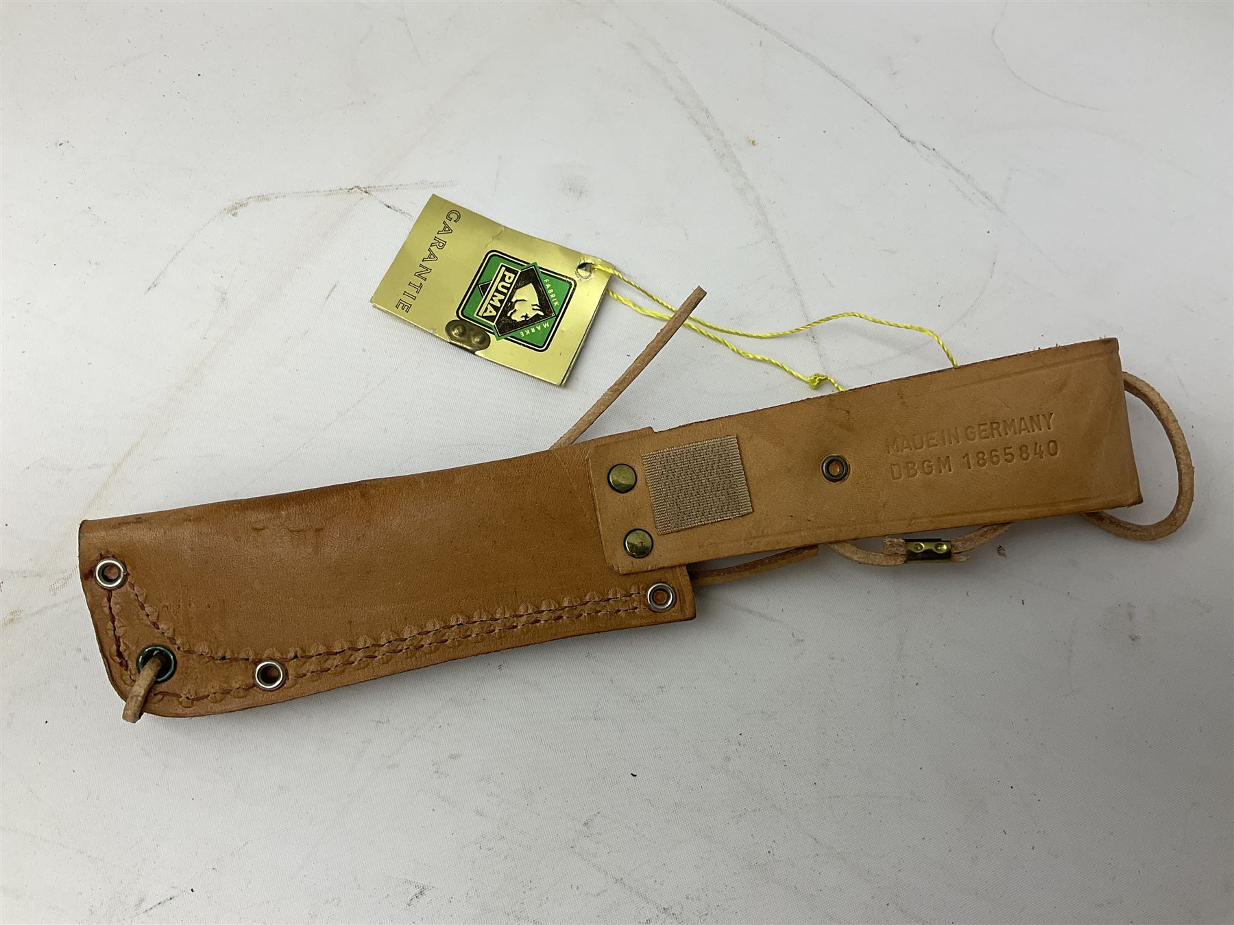 German Puma Hunter's-Pal knife, the 10cm steel blade marked model 6397, serial No.72573 to guard, fixed blade, antler scales; in original hard plastic case with paperwork and guarantee label; with brown leather sheath marked Puma L22.5cm overall