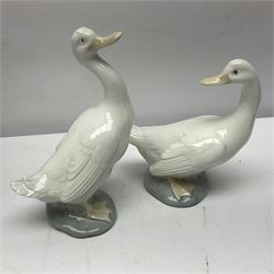 Two Lladro figures, Over the Threshold no 5282 and Prayful Moment no 5500 together with five Nao figures