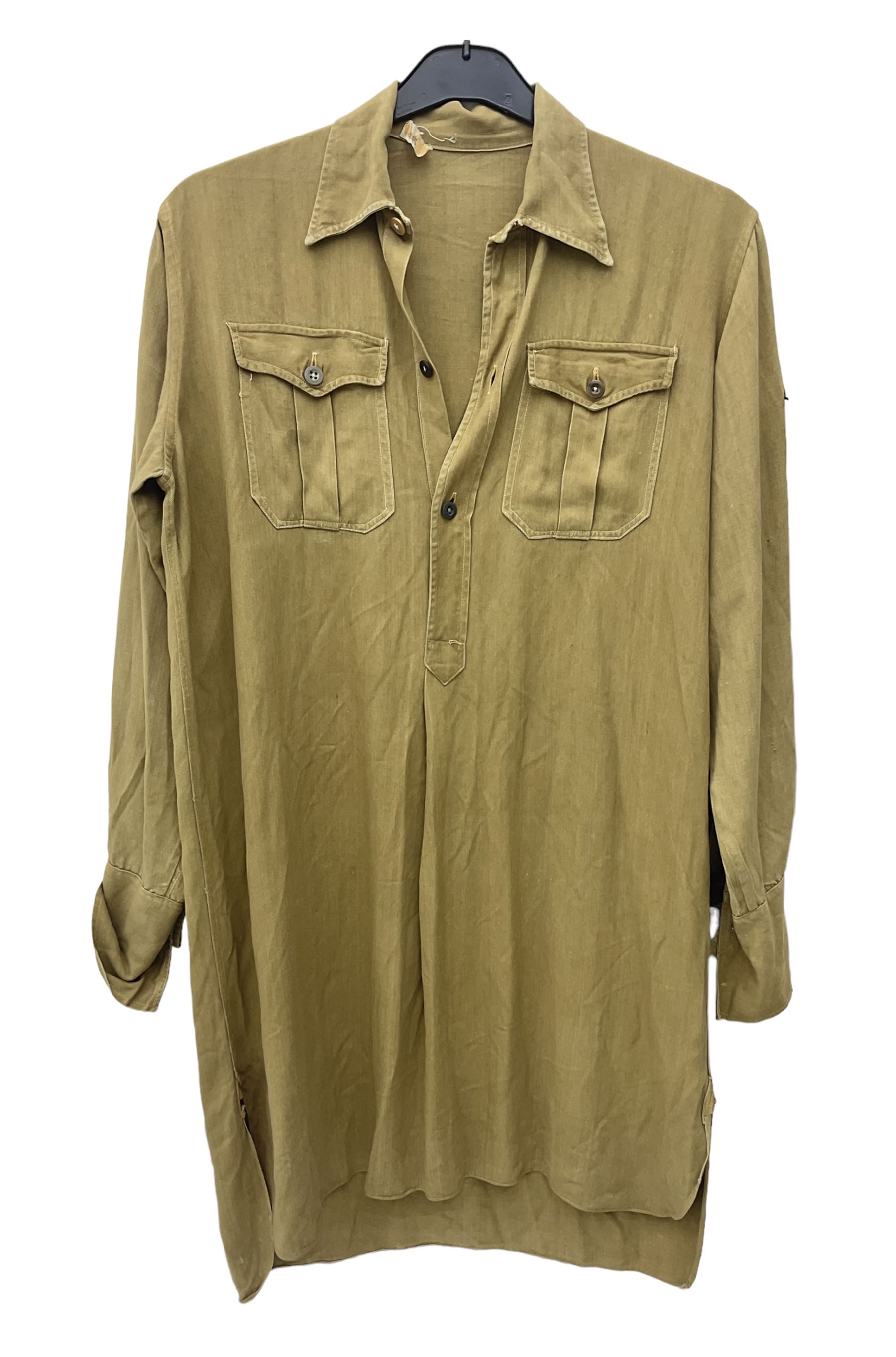 1930s Hitler Youth brown shirt, long length with two pockets, bears triangular badge 'Nord Nordsee'