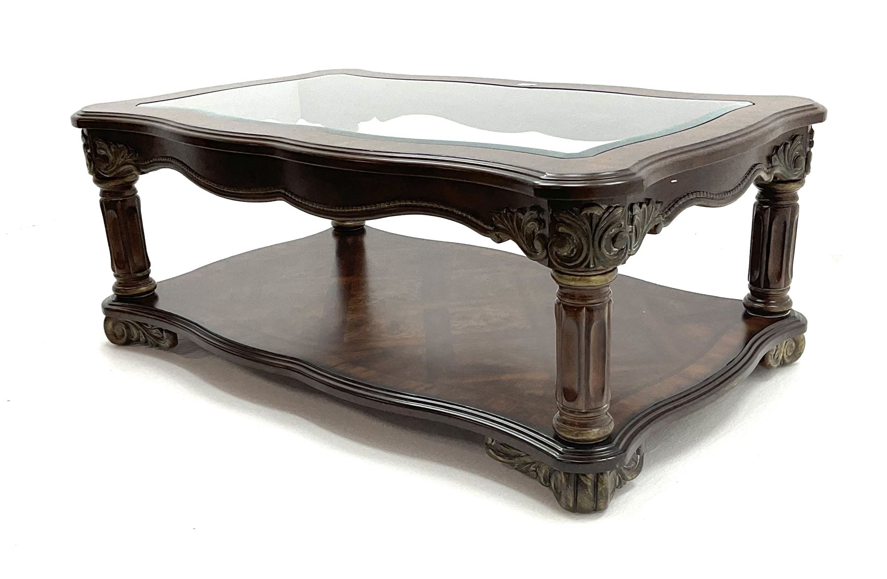 Kevin Charles American walnut rectangular serpentine coffee table , inset glass top, carved column supports joined by undertier 