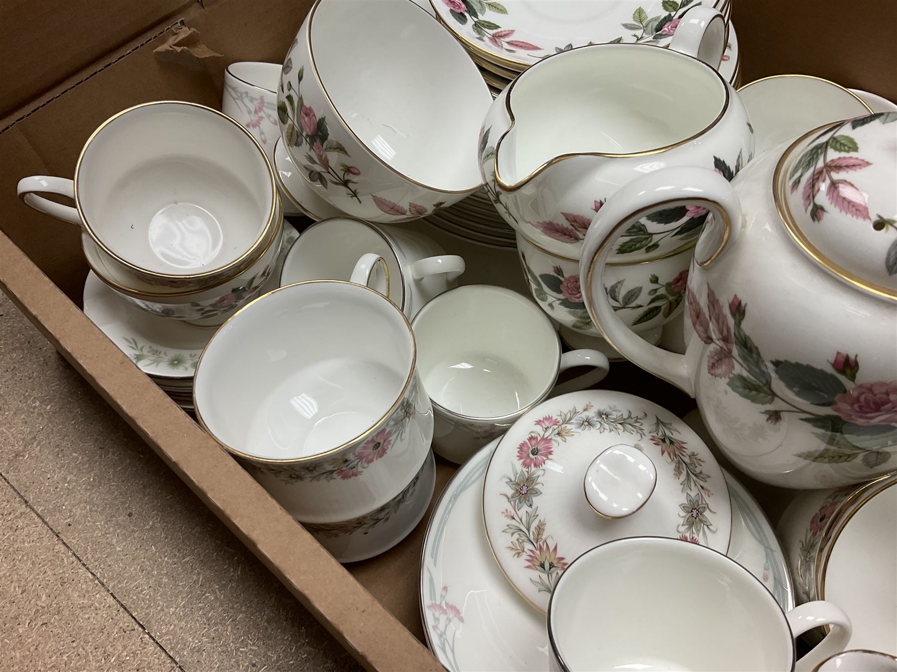 Paragon part dinner service in Belinda pattern, including teapot, six tea cups and saucers, dinner plates etc, together with Royal Doulton part tea service in Carnation pattern, Wedgwood part tea service in Hathaway Rose