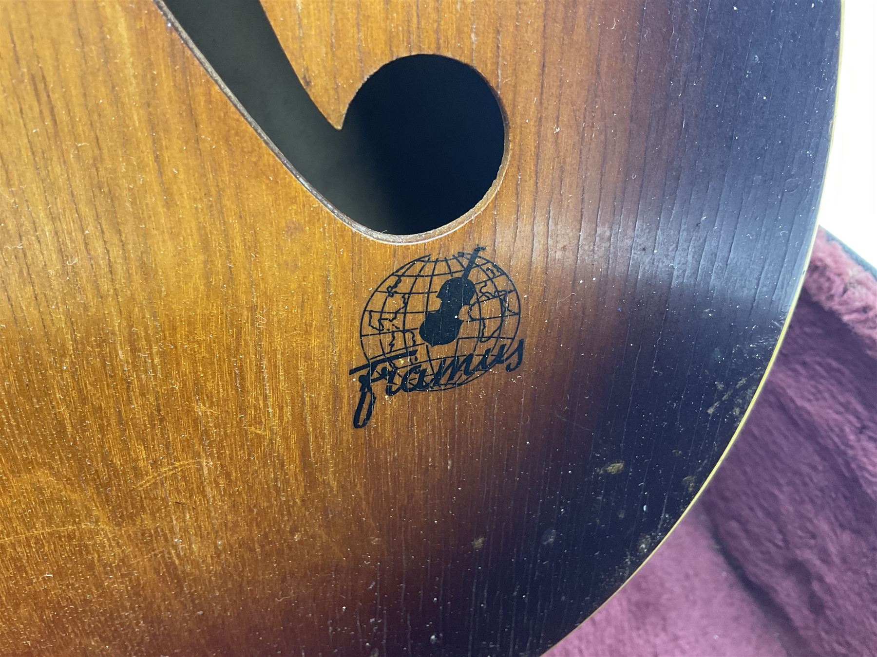 1950s Framus arch top acoustic guitar with sunburst finish and Framus logo to top, No.1937 L104cm; in hard carry case.
