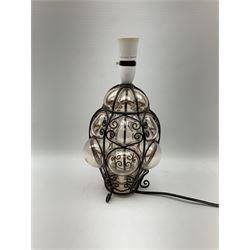 Continental glass ceiling light encased in an iron frame with scroll design H35cm, along with a matching table lamp H35cm, with a cream lampshade with tassel detail.  